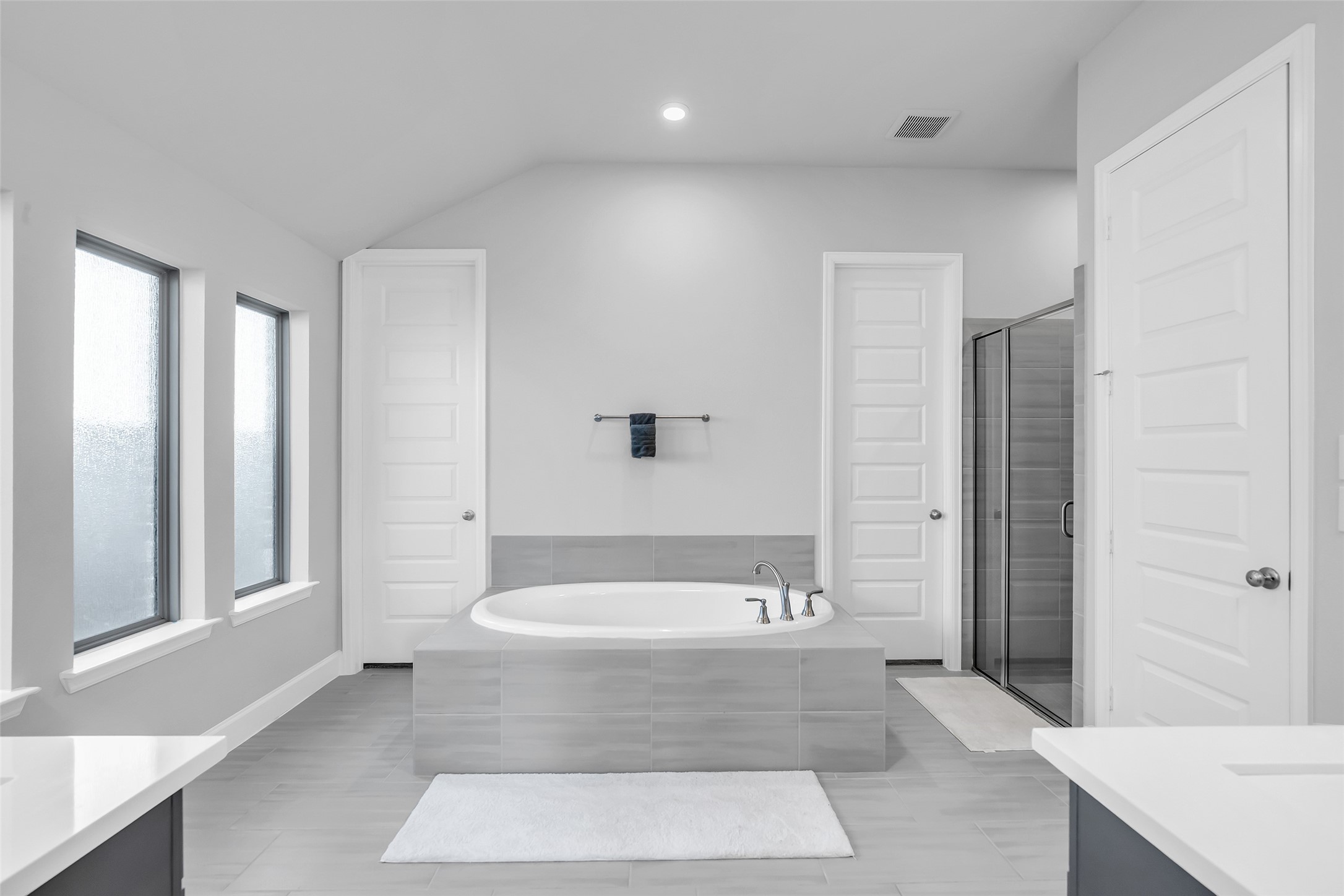 Maximize Relaxation In Your Spacious & Elegant Bathroom: Featuring A Large, Soaking Tub, Separate Glass-enclosed Shower, & Abundant Privacy & Natural Light From Large Frosted Windows.
