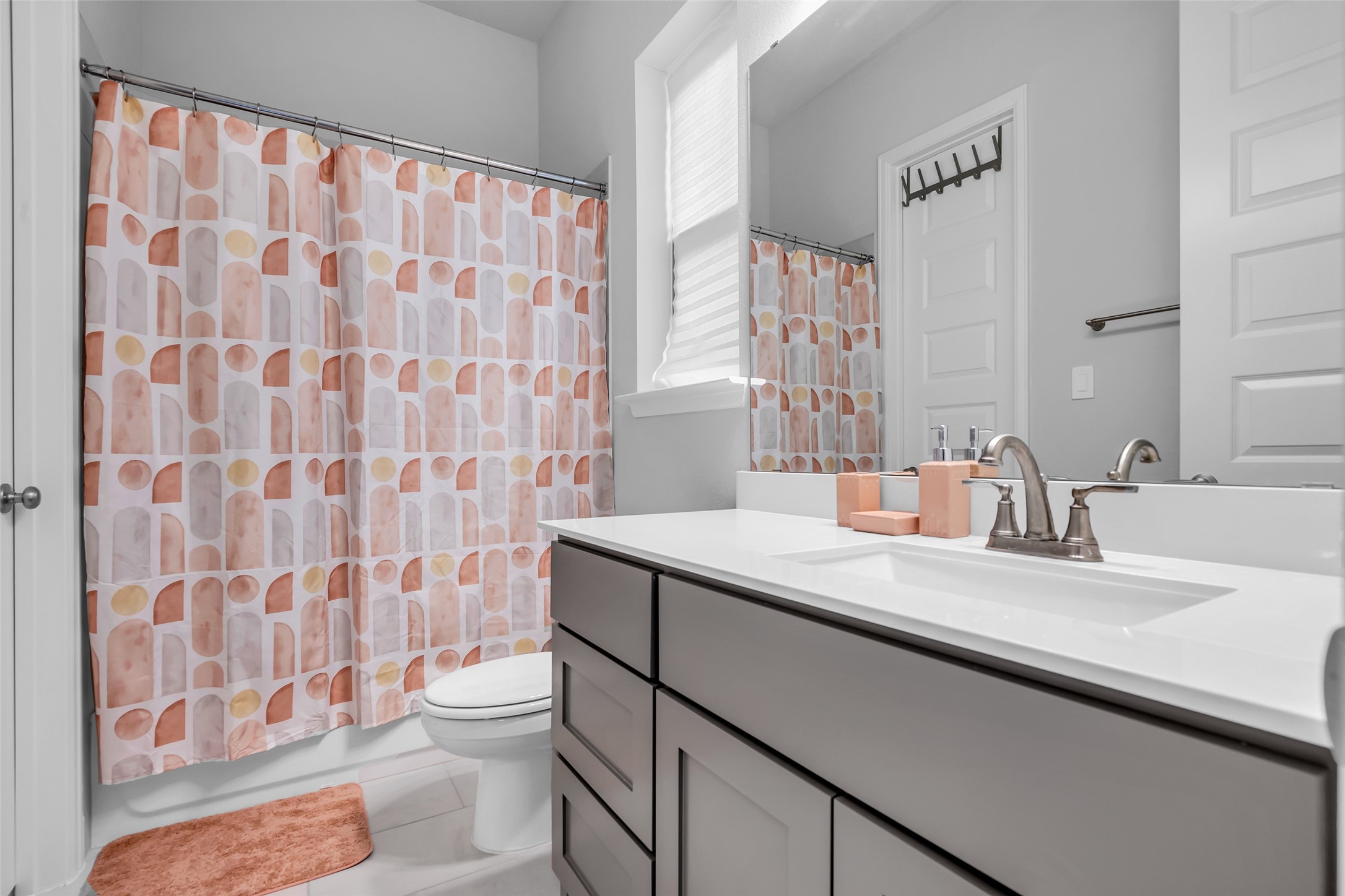 Ensuite Bath #1: w/ Sleek Fixtures, Large Vanity, & Stylish Design