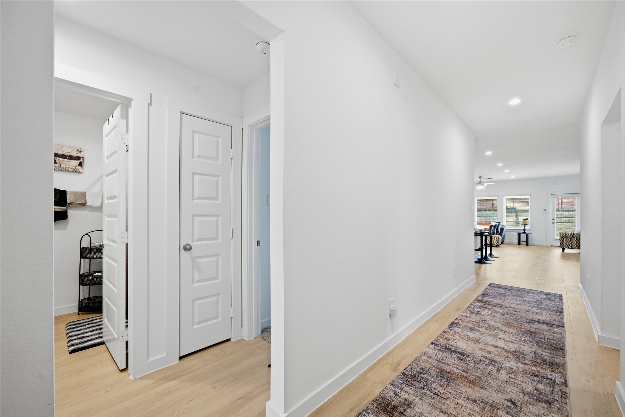 As you enter this lovely home, there are 2 secondary bedrooms and a full bath to the left.