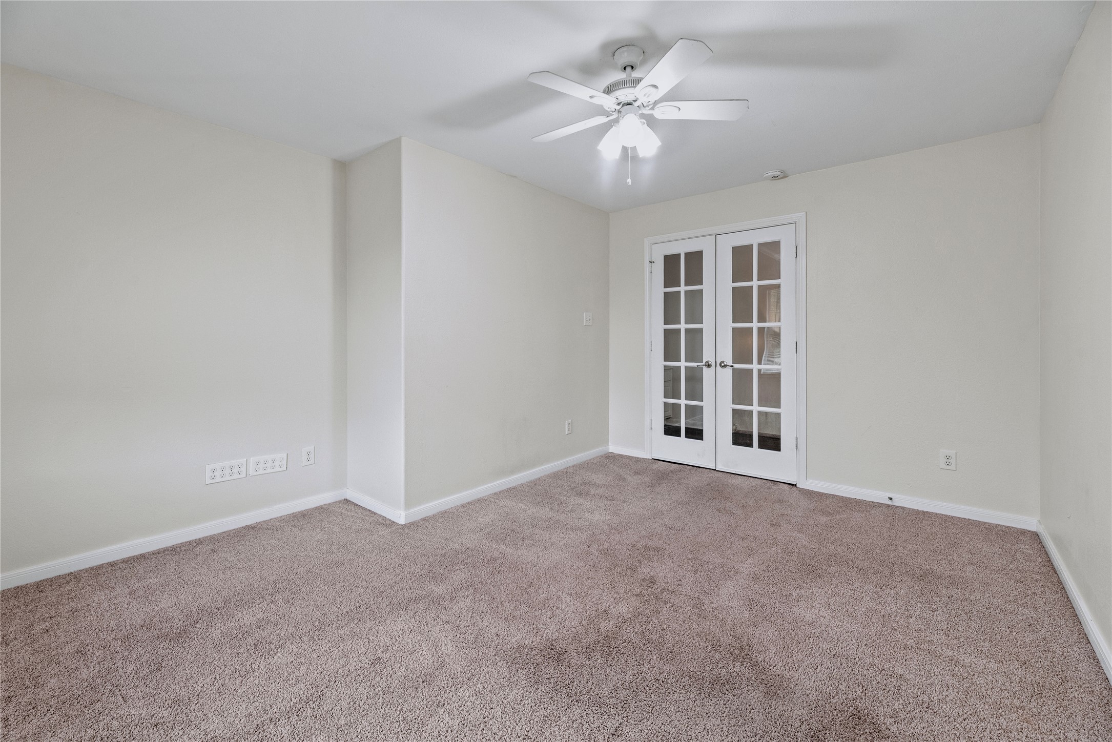 French doors give this room a distinct connection to the upstairs hall, offering a flexible setting for a home office, lounge or other everyday use.