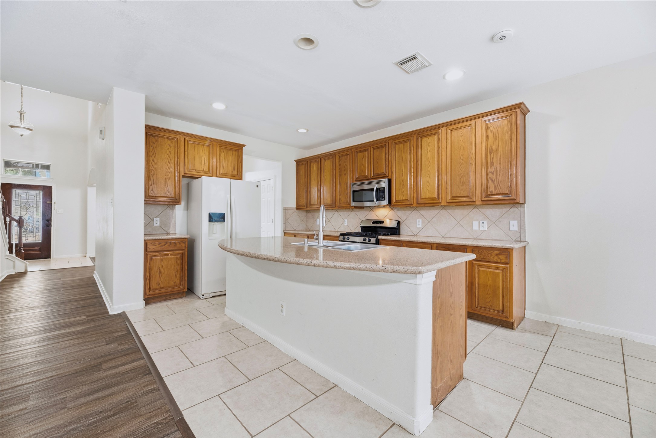 From the family room, the island keeps the kitchen in easy reach and open to conversation, with the breakfast area alongside for everyday meals.