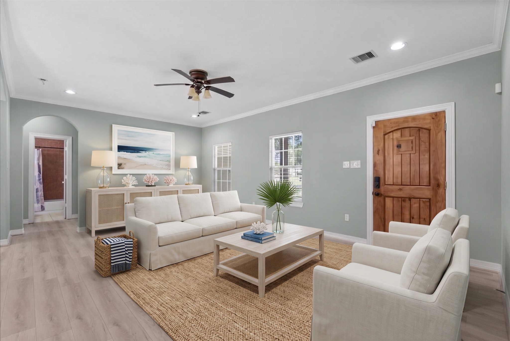 Crown molding and an arched hallway entry add architectural interest.