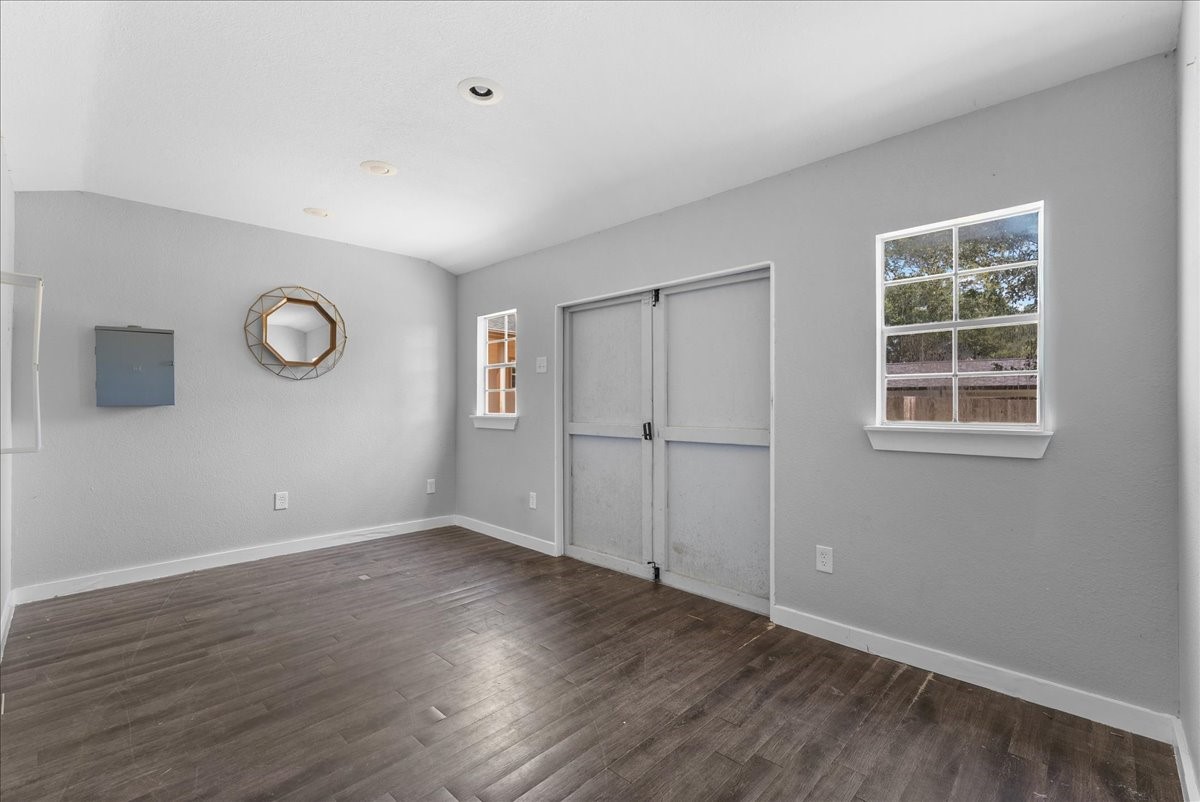 Fully finished inside with wood flooring, recessed lighting, and its own electrical panel, this hardwired space includes windows for natural light and a double door entry, offering true flexibility as a home office, gym, or studio.