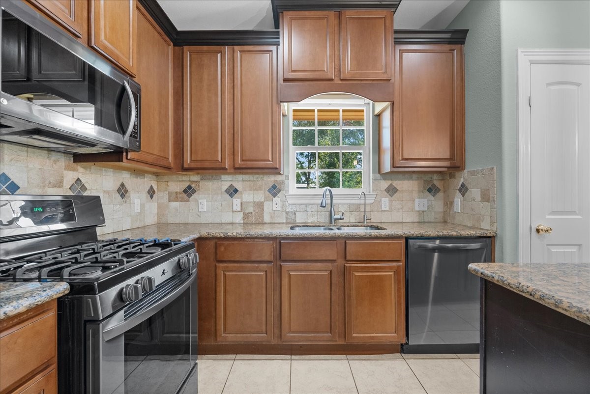 Abundant cabinet storage complete a layout that opens directly into the dining and living areas.