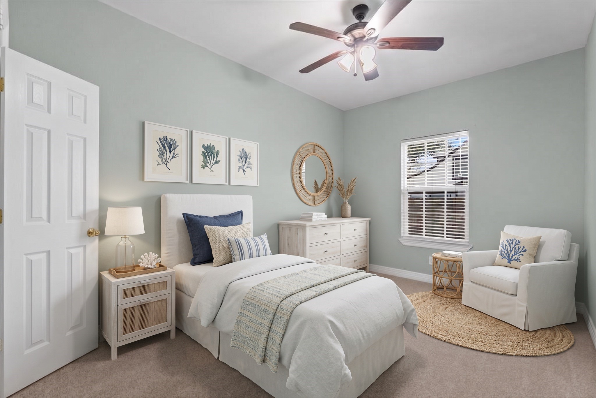 New carpet, a ceiling fan, and a corner window bring natural light into this bedroom, with a reach-in closet offering storage. Fresh neutral paint keeps the space bright and versatile.