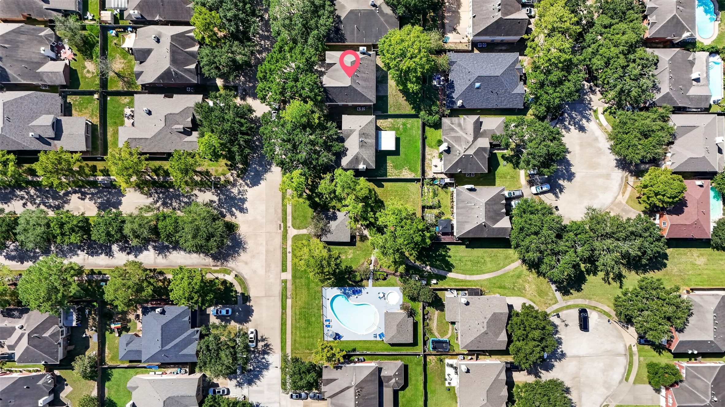 Aerial View  Property Location

Bird's-eye view highlighting the home's location within Highland Trails, surrounded by mature trees, established landscaping and nearby residential streets.