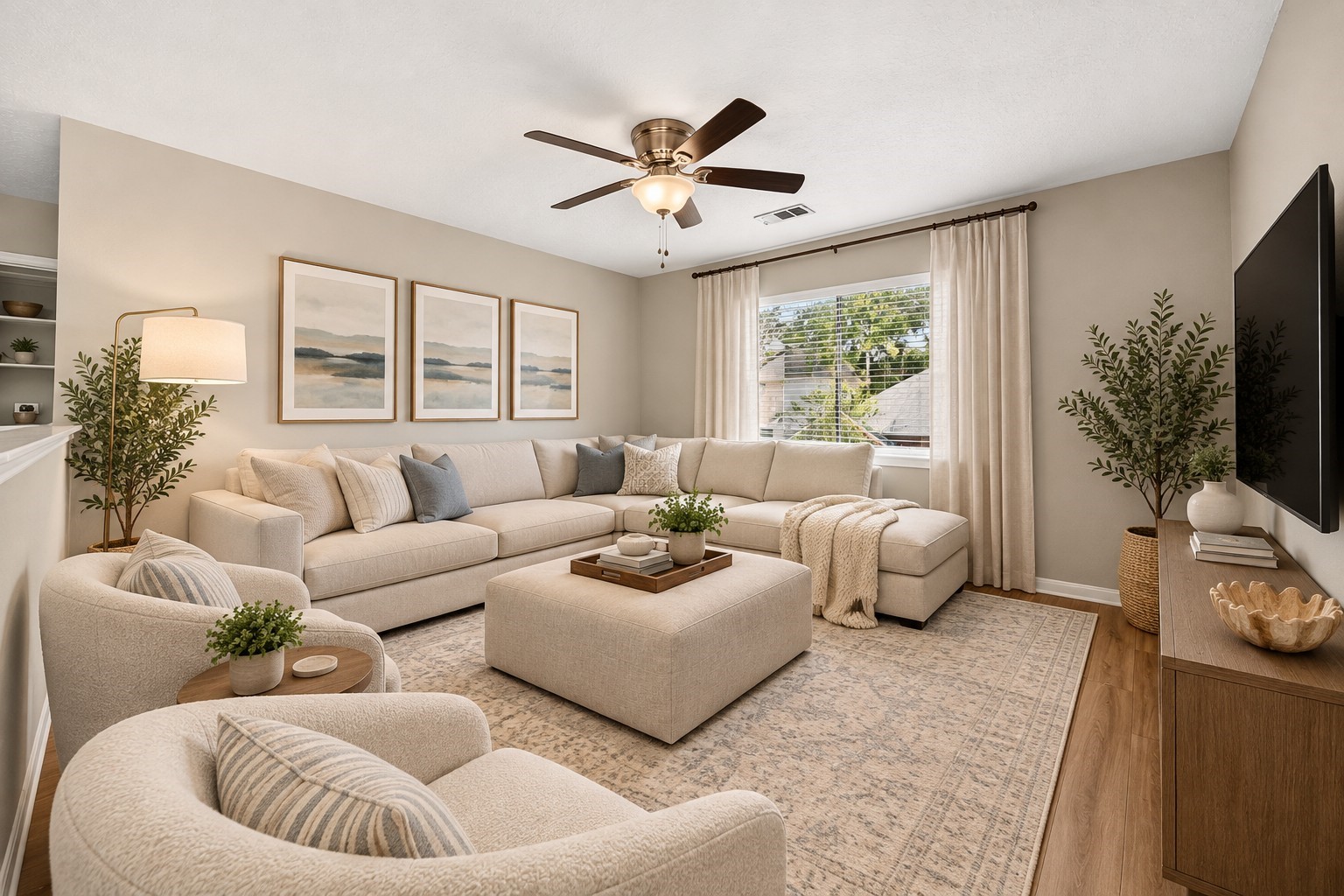 Additional Living Room: Spacious second living area offers flexible room for relaxing or entertaining, highlighted by a large window, wood-look flooring and an inviting layout.