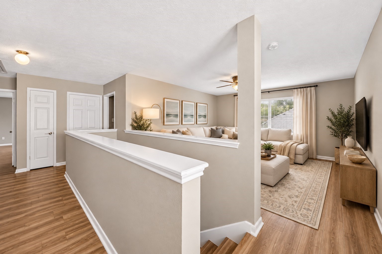 Upstairs Loft / Additional Living Area: Spacious upstairs living area features beautiful wood-look flooring, abundant natural light and an open, versatile layout, offering an inviting space for relaxation, entertainment or a media room.