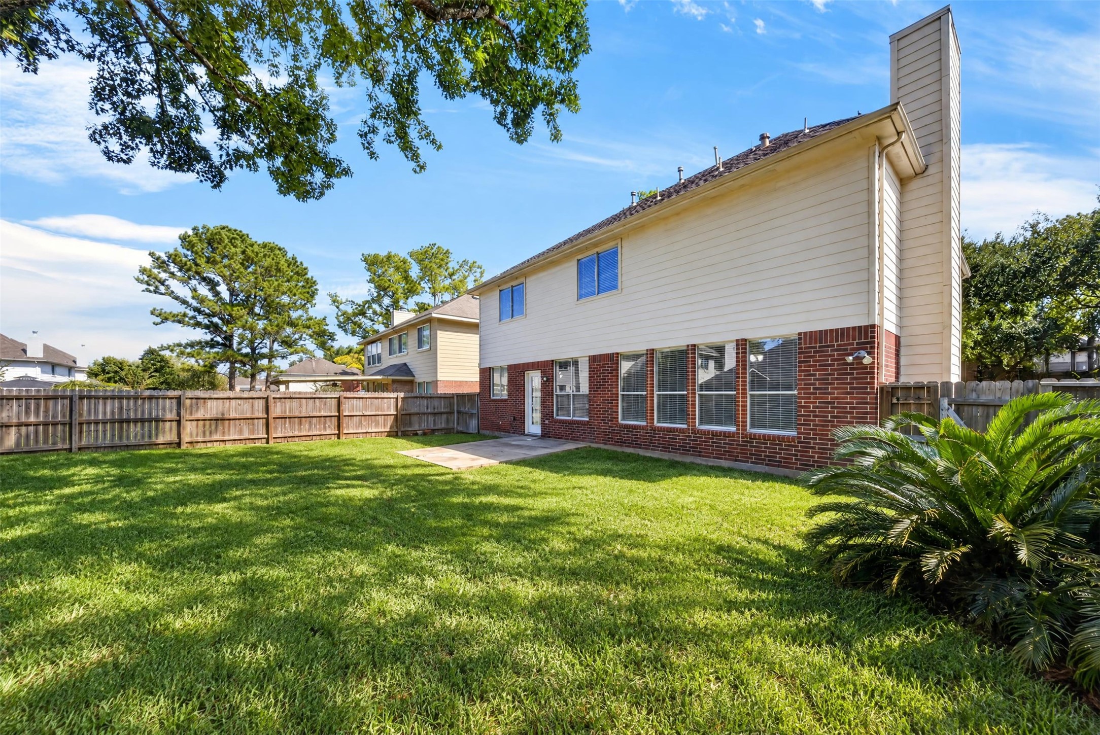 Backyard  Alternate View

Spacious, fully fenced backyard features a lush green lawn, mature shade trees and an open patio area, offering an inviting setting for outdoor relaxation and entertaining.