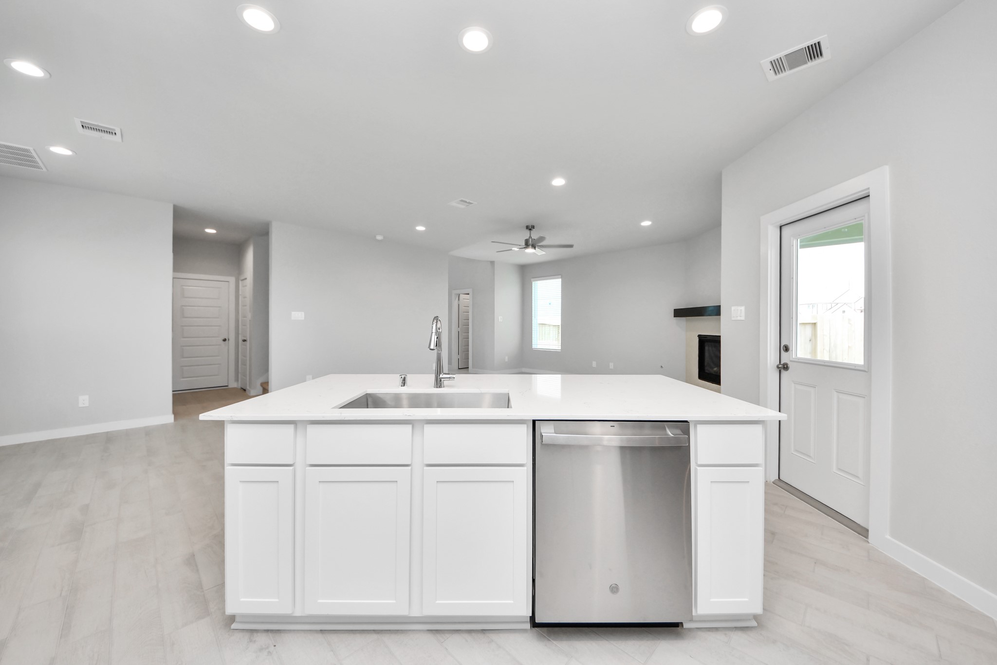 All of this overlooks your expansive family room, creating a perfect space for culinary delights and family gatherings. Sample photo of completed home with similar floor plan. Actual colors and selections may vary.