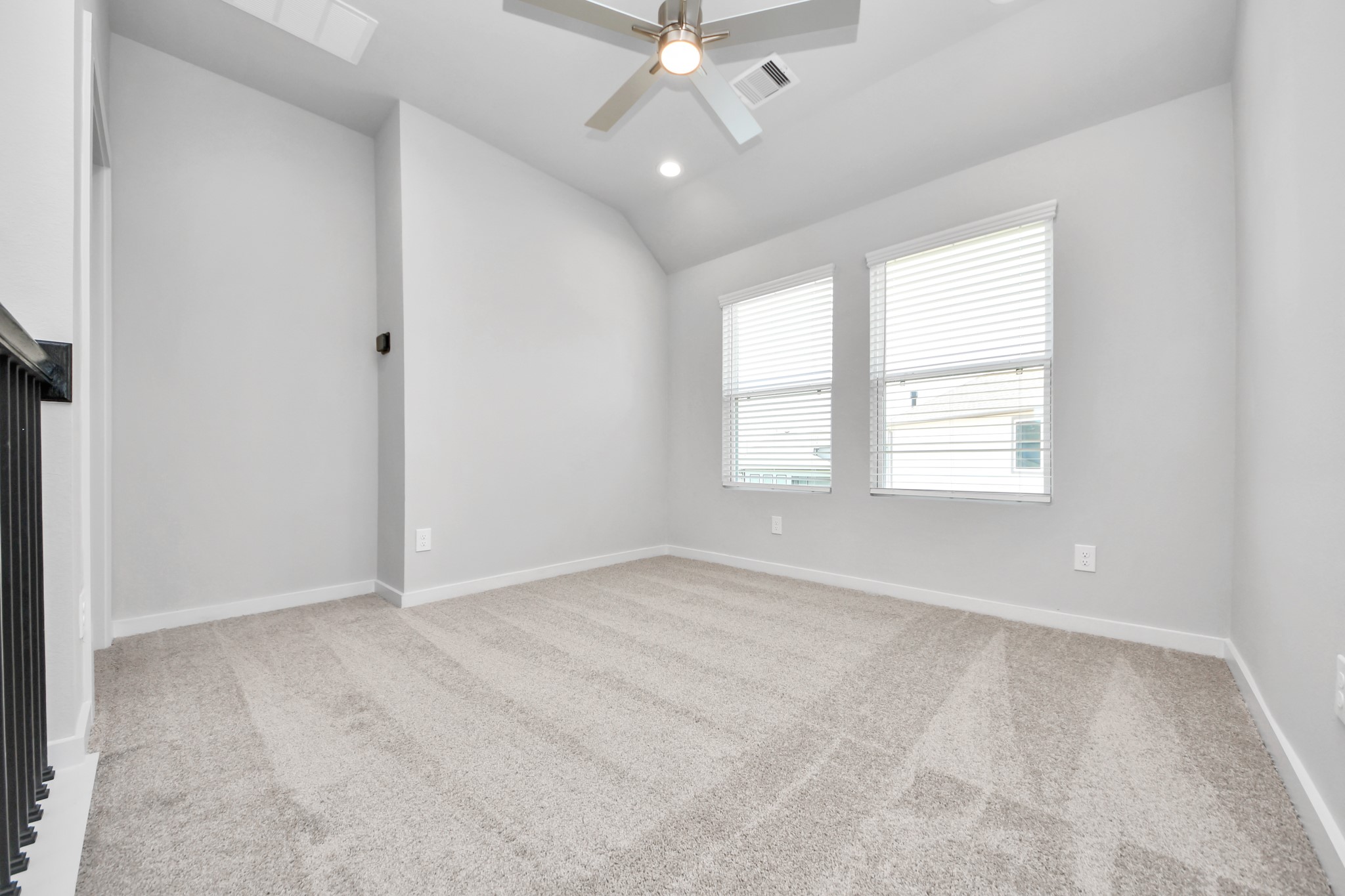 Come upstairs and relish a day of relaxation in this loft area! Ideal as an additional living space or game room, it boasts plush carpeting, high ceilings, custom paint, and windows that flood the area with abundant natural light. Sample photo of completed home with similar floor plan. Actual colors and selections may vary.