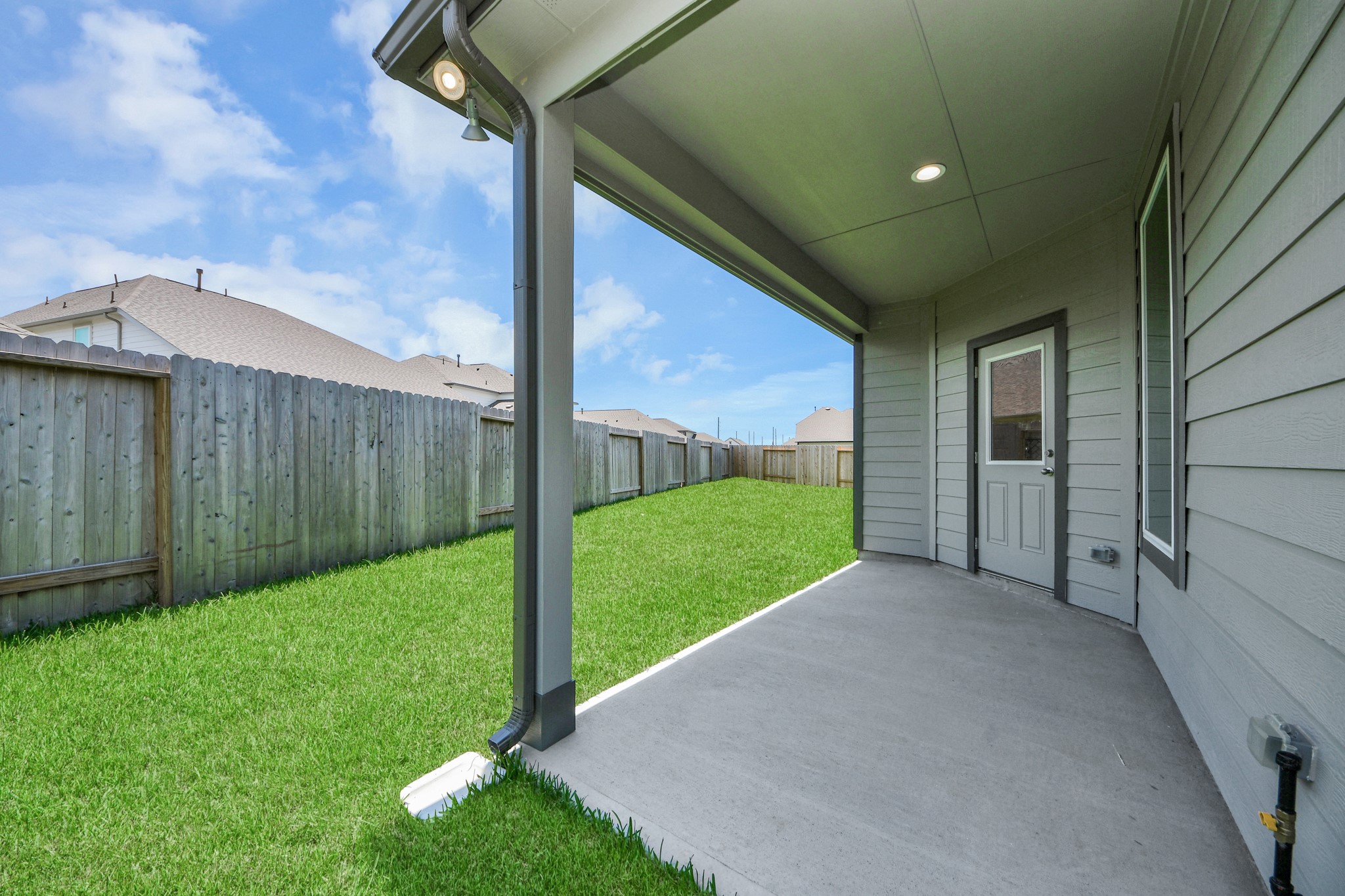 Backyard retreat, offering an abundance of space for kids to play and explore. The possibilities are endless in this outdoor haven, where the joy of open-air activities and family gatherings awaits. Sample photo of completed home with similar floor plan. Actual colors and selections may vary.