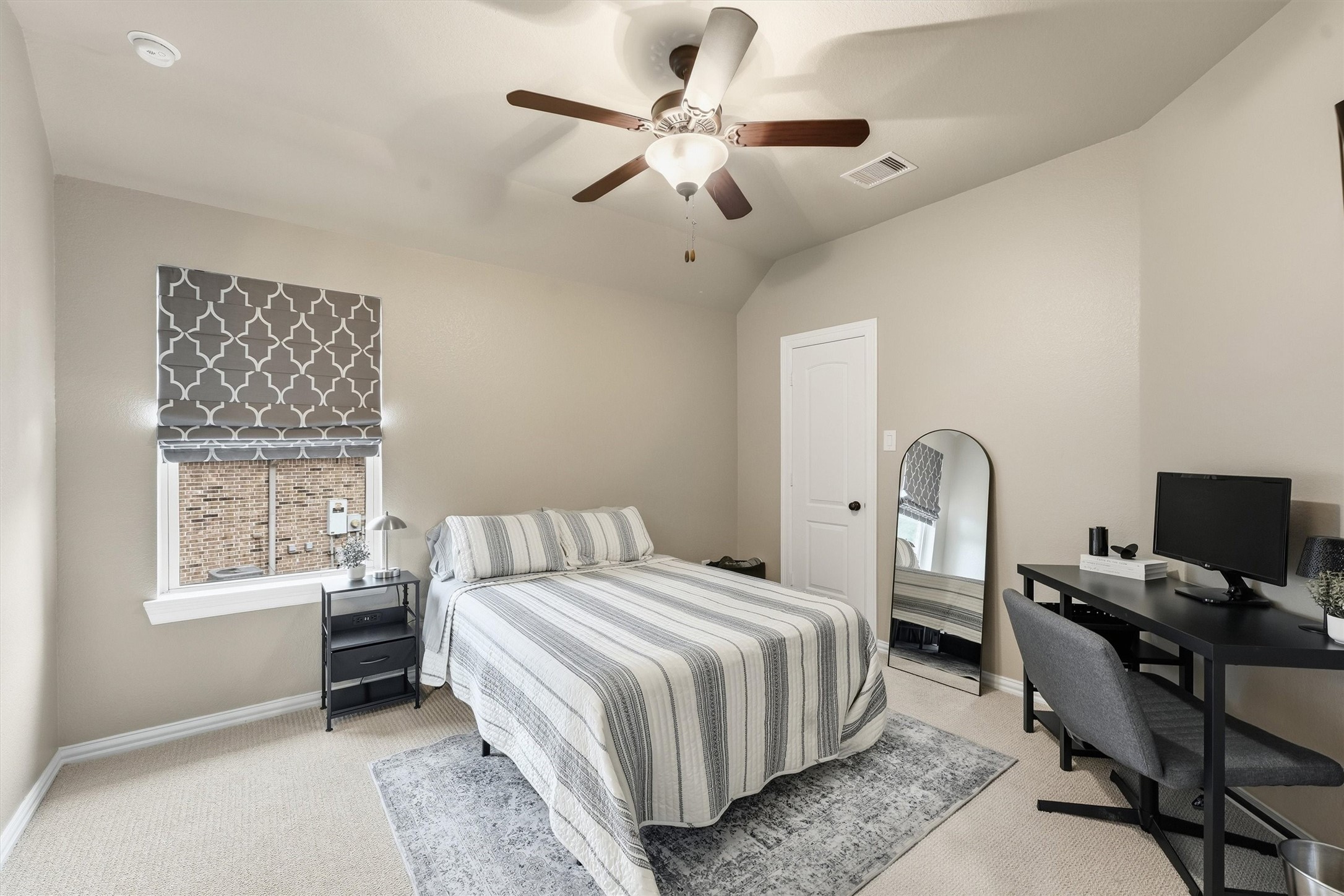 Comfortable bedroom with abundant natural light.
