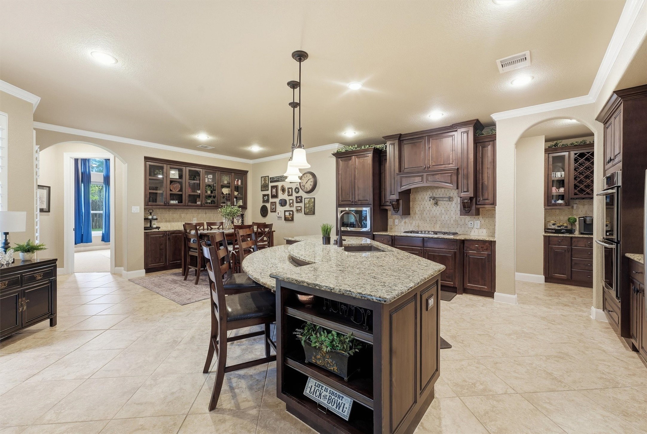 Abundant cabinetry and generous prep space.