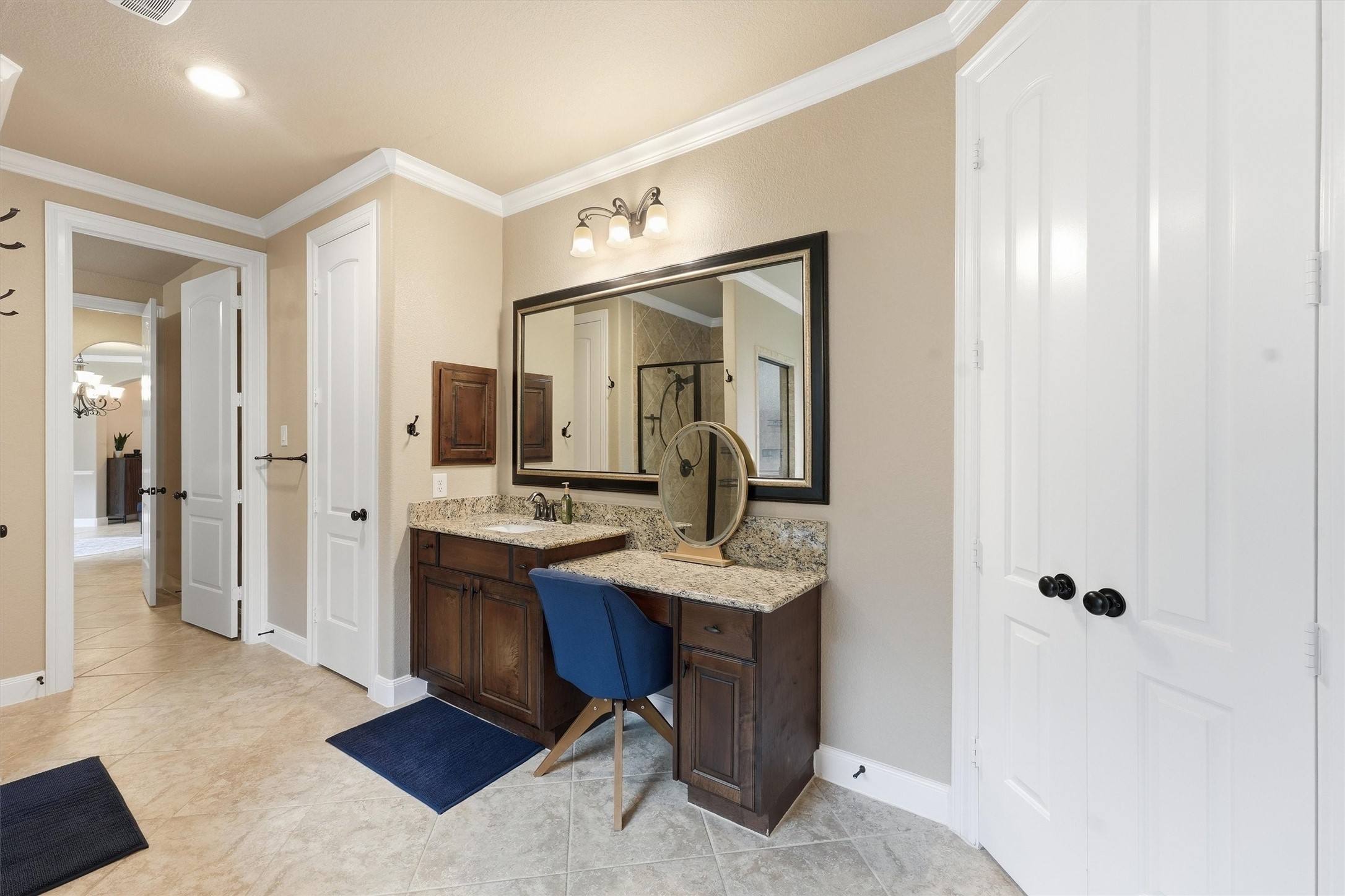 Separate walk-in shower and dual vanities.