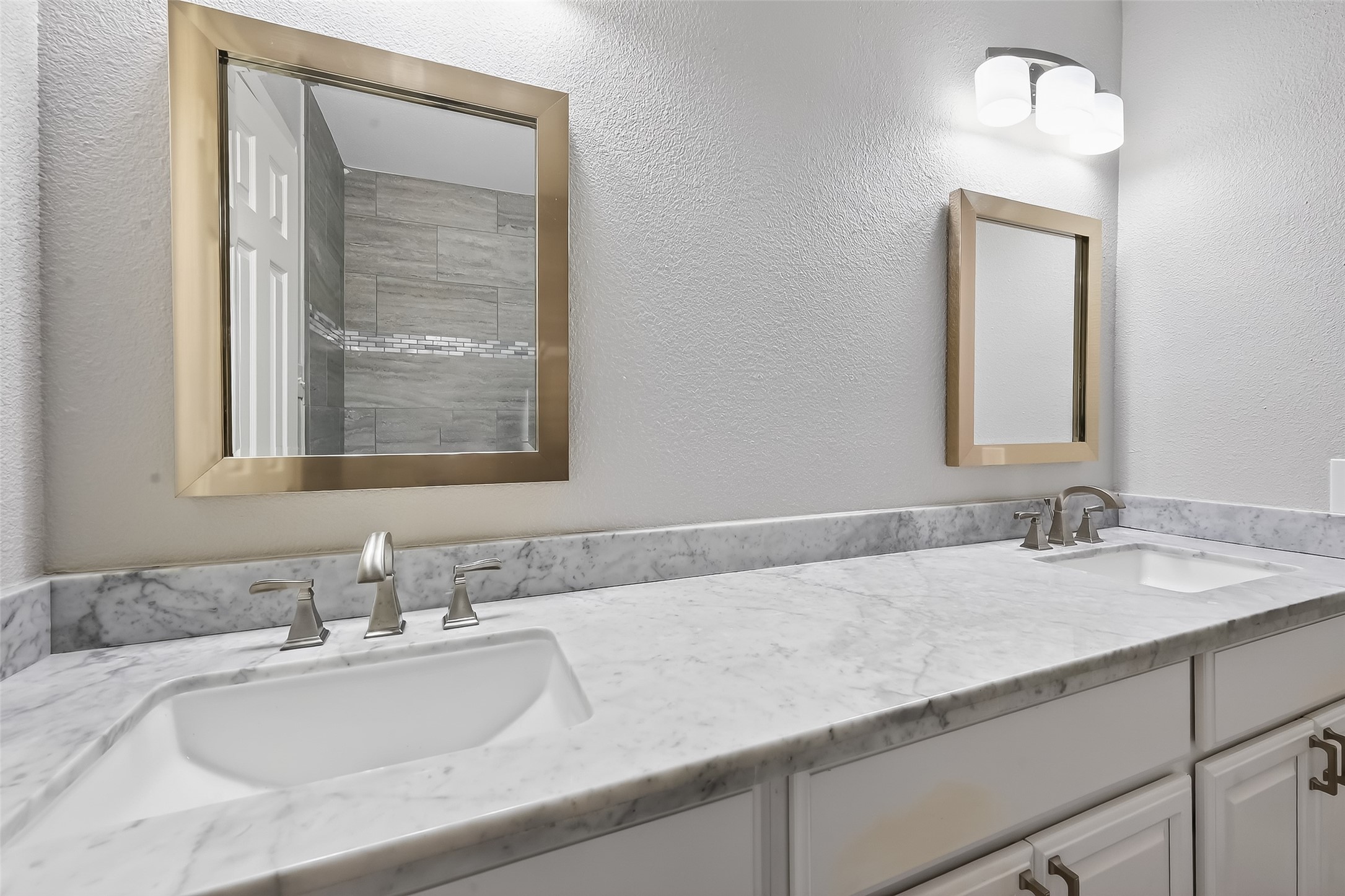 Updated secondary bathroom with modern finishes, upgraded countertops, and clean contemporary design.