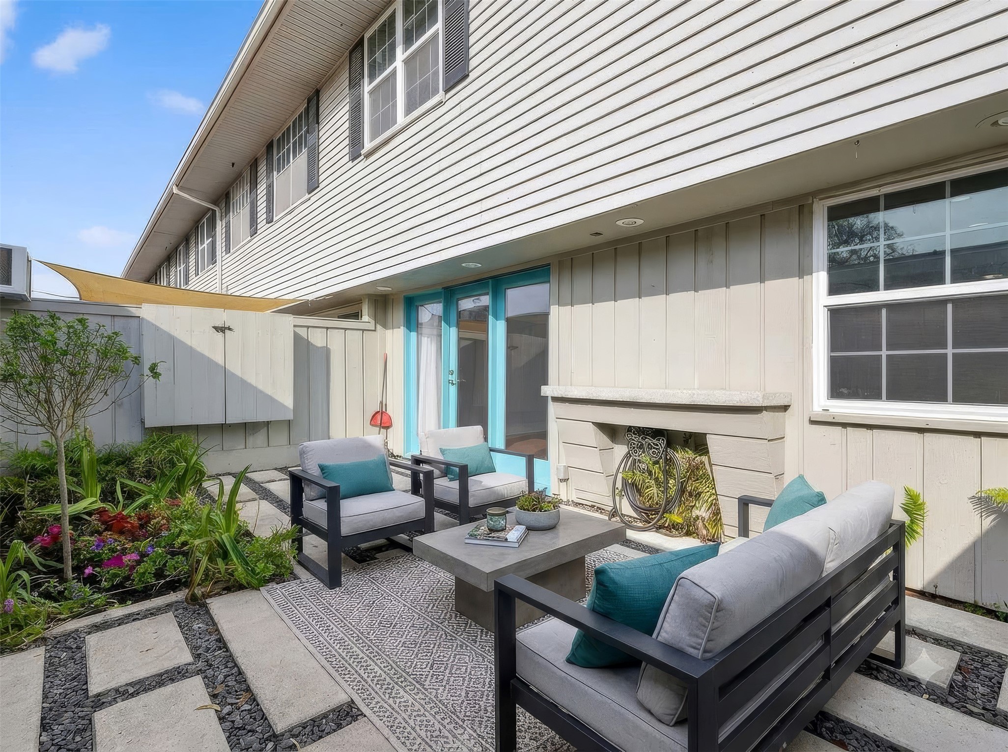 Private upgraded patio with pavers, outdoor TV hookup, and patio lighting ideal for outdoor entertaining in Houston.