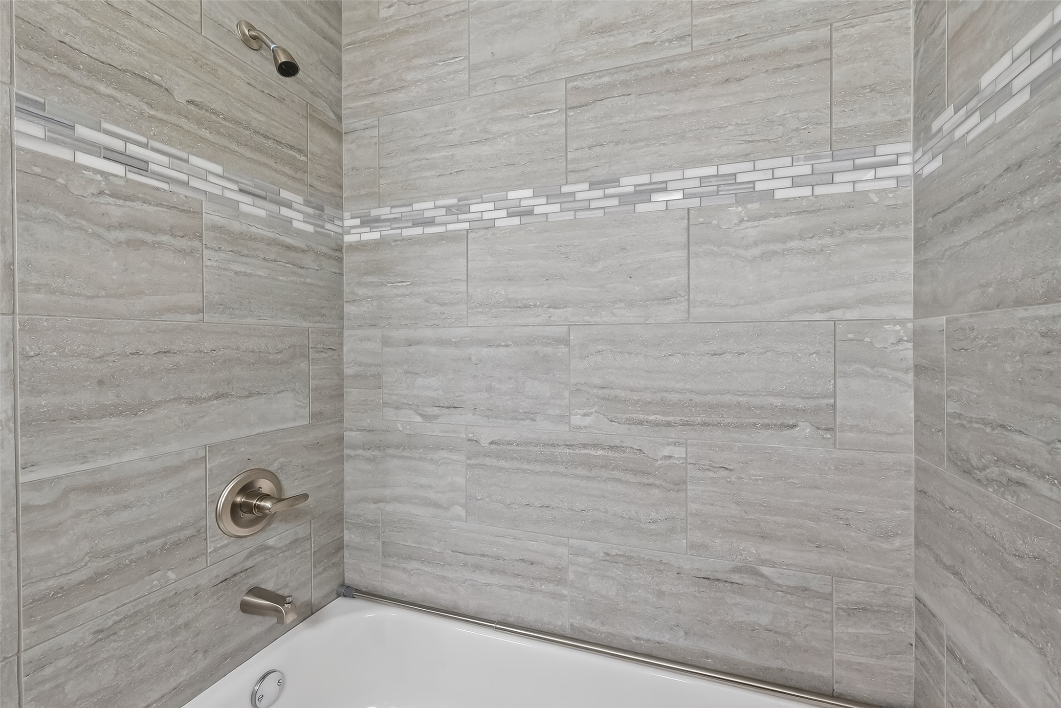Updated secondary bathroom with modern finishes, upgraded countertops, and clean contemporary design.