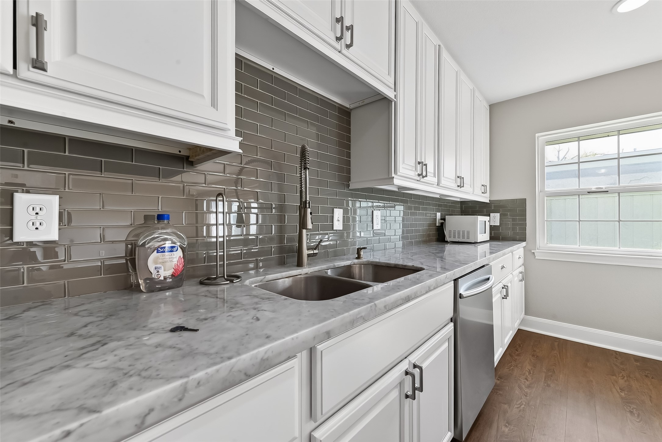 Closer look at the elegant Carrera marble countertops.