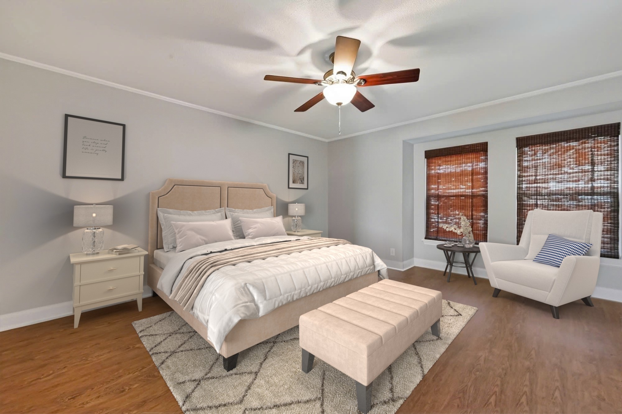 Spacious primary suite with updated flooring, natural light, and room for a king-sized bed and seating area.