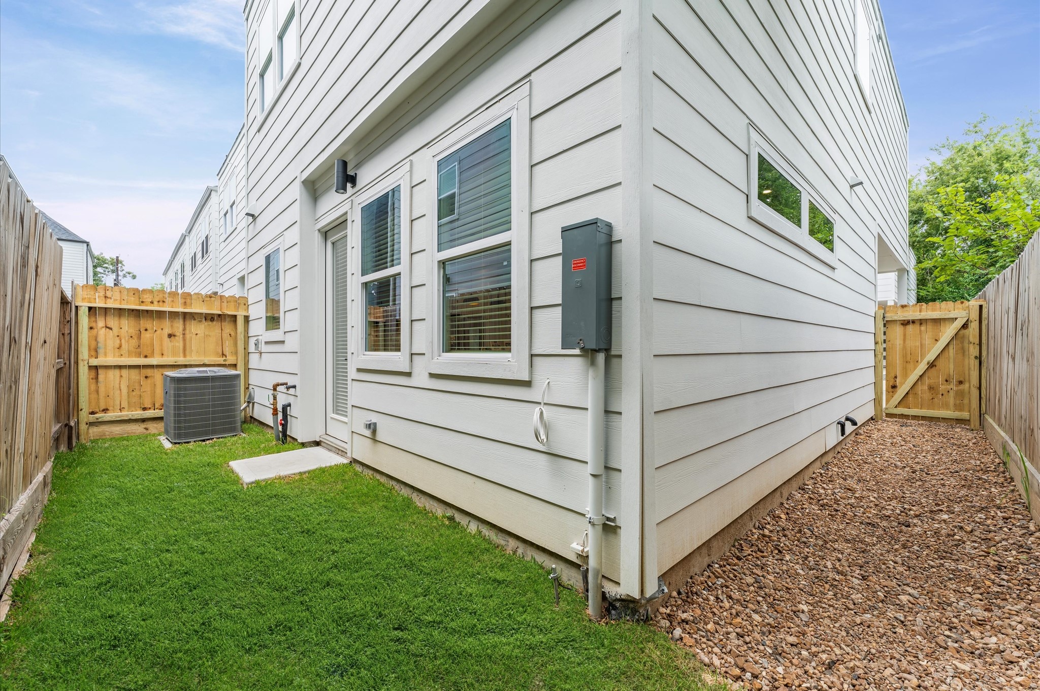 This charming small backyard offers a cozy outdoor escape, thoughtfully arranged to maximize space and comfort. Whether framed by lush greenery, a petite patio, or a few well-placed planters, the area invites relaxation and connection with nature.