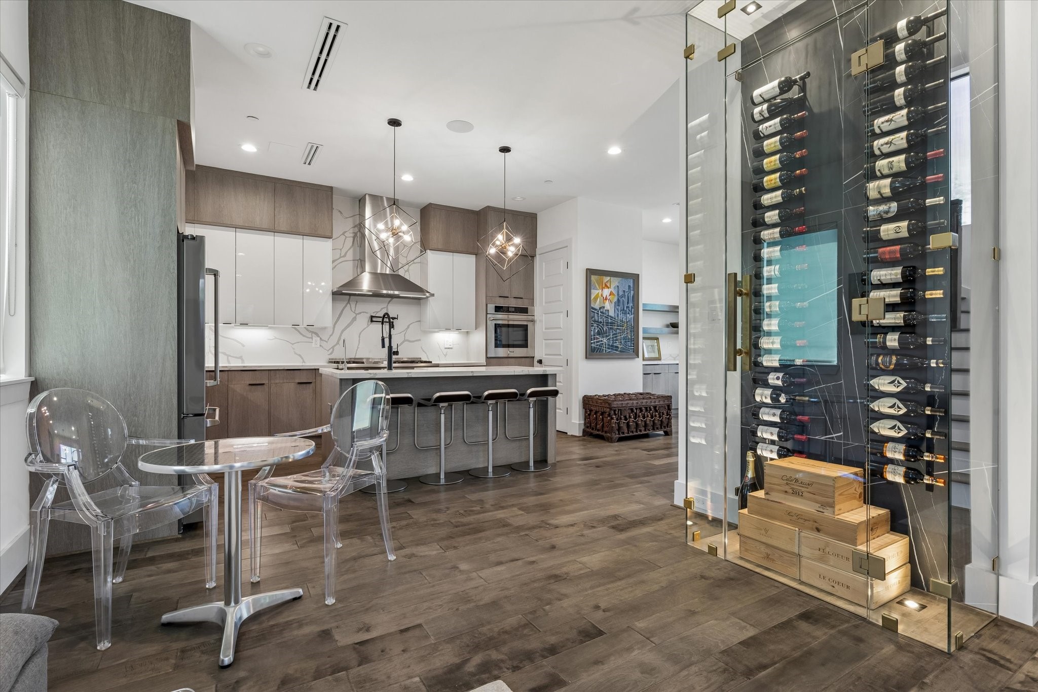 The living room flows seamlessly into a gourmet kitchen.