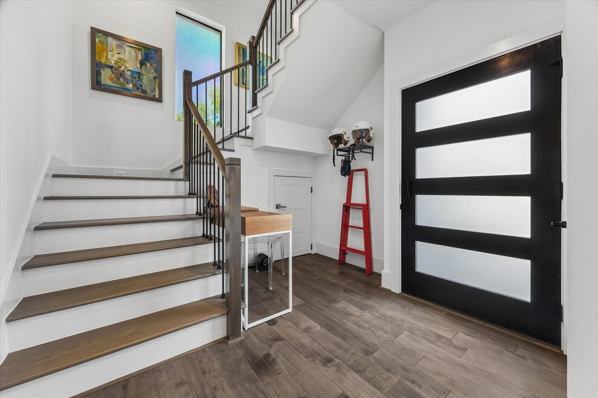 Welcome to your new home: a stylish and inviting entryway featuring modern finishes and elegant decor.