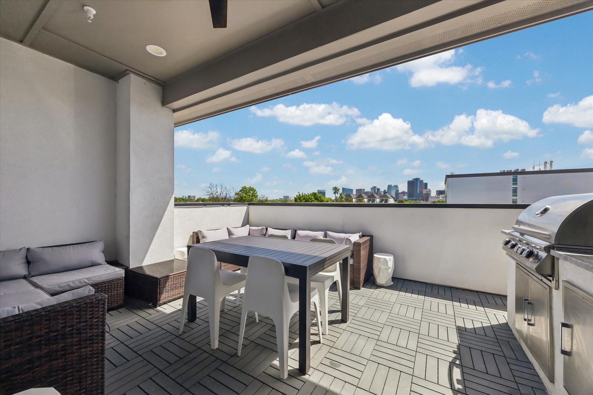 Experience luxury living with a stunning 4th-floor outdoor kitchen and patio, offering breathtaking views and perfect for entertaining.