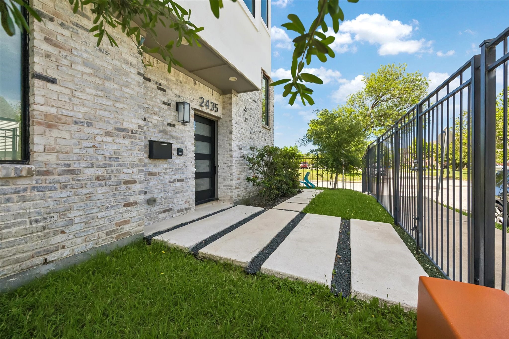 Gated entrance and pavers welcome you into the home.