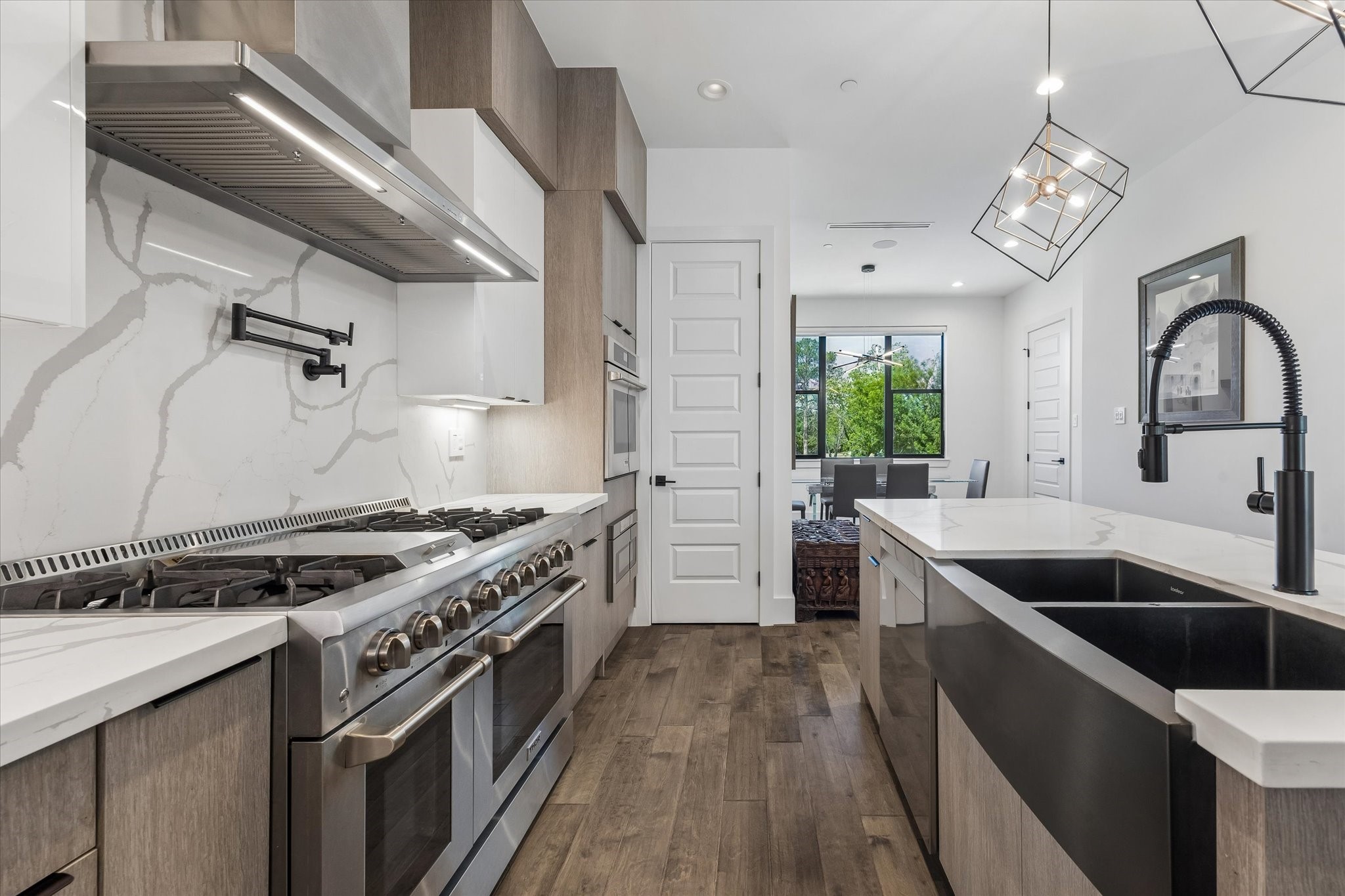 The chefs kitchen that opens to the dining room with 3 ovens perfect for entertaining.