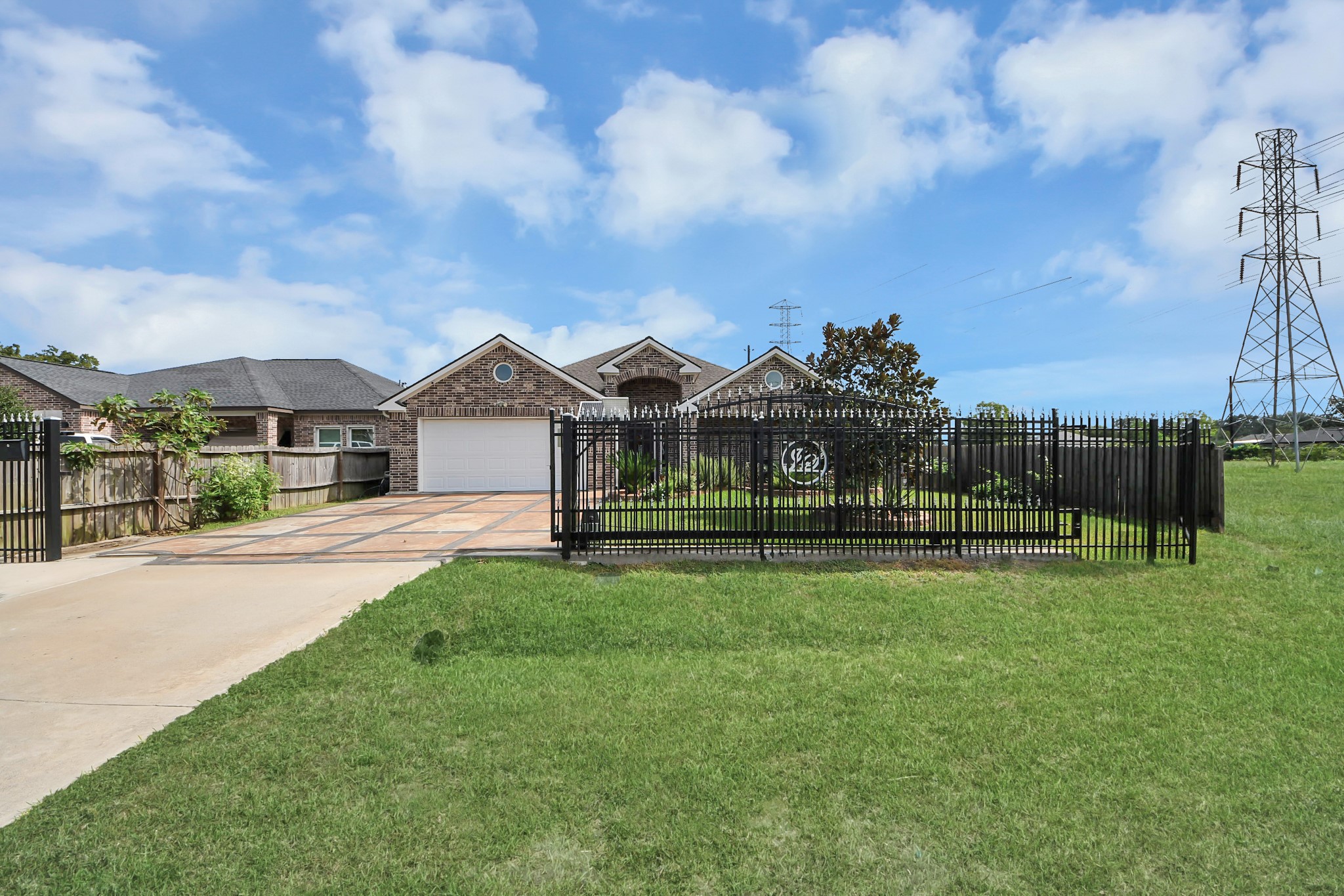 Front lawn and driveway offer an open view of the property.