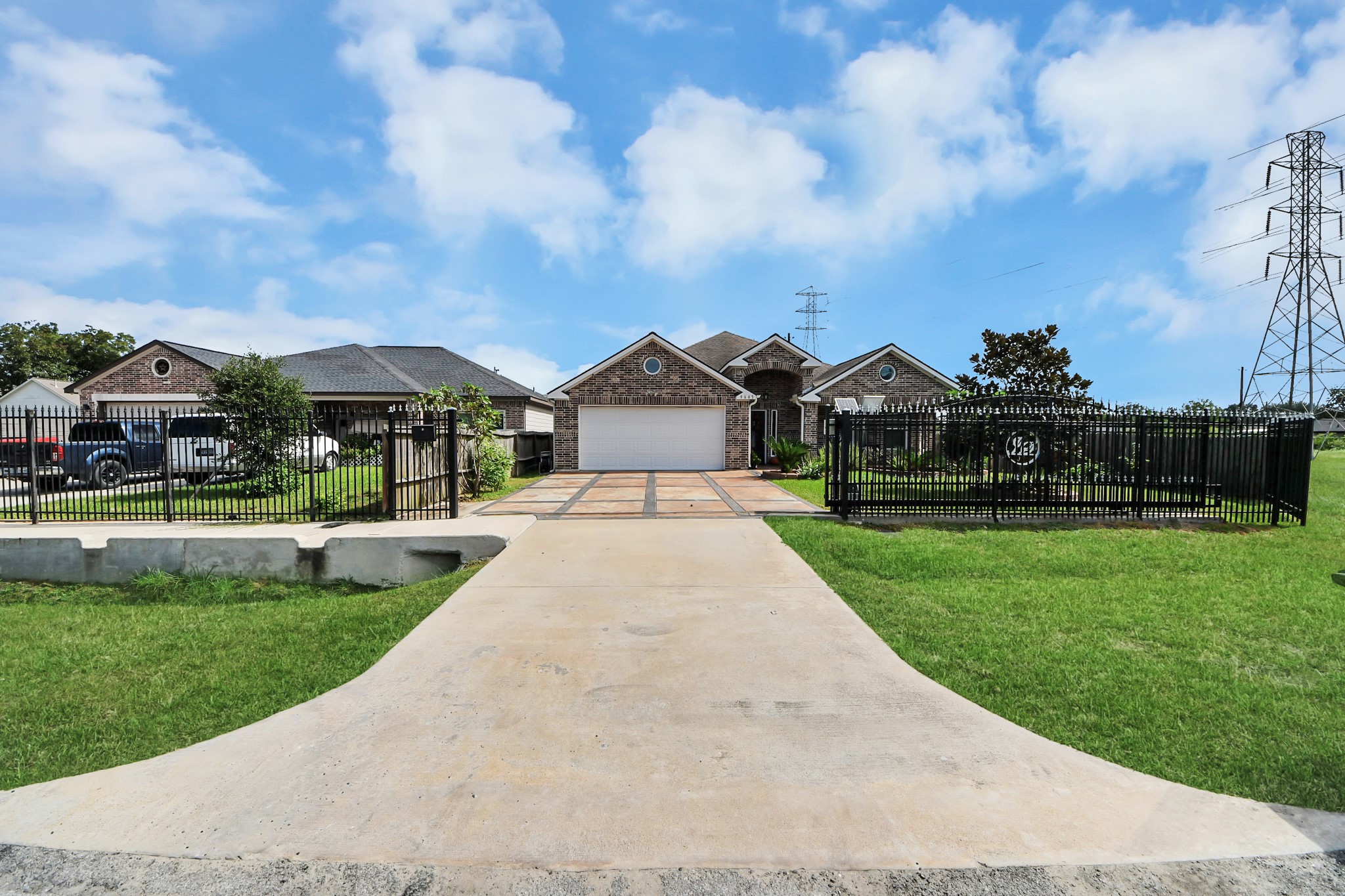 A long driveway leads to this Houston home and garage.