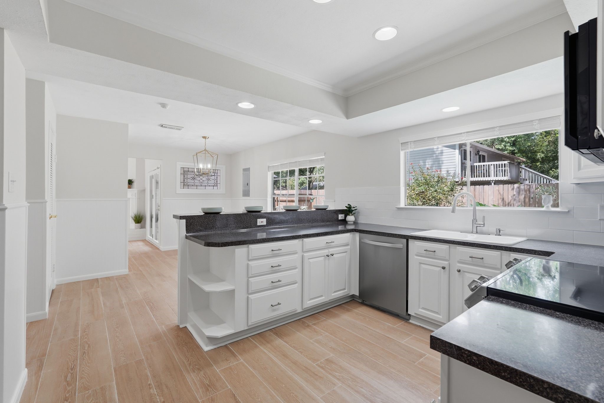 Conveniently located next to your formal dining room is your open kitchen with scenic views of your serene backyard.