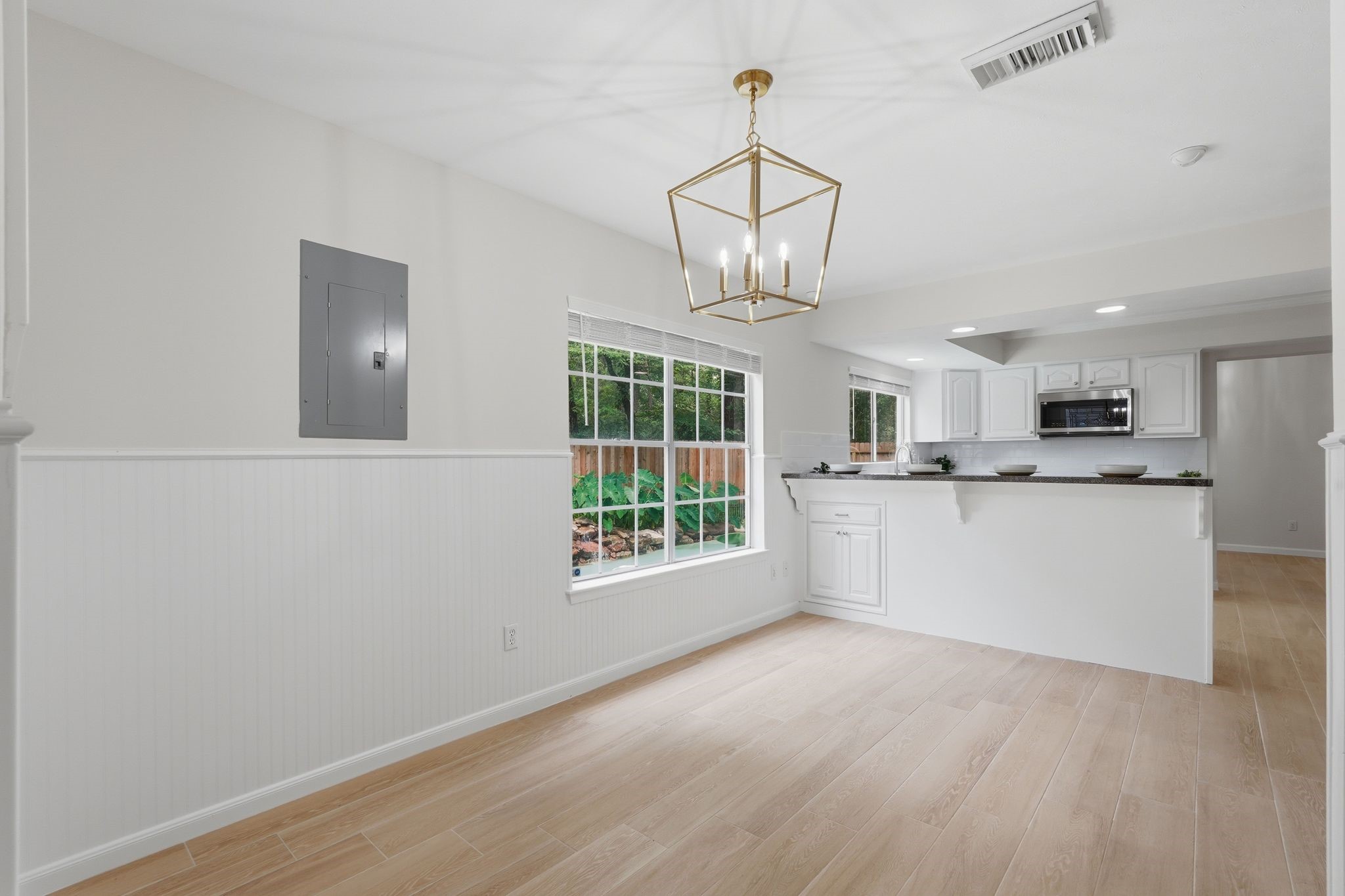 Just off the kitchen is your breakfast nook with flexibility for multiple table options. It can fit a square, circle or round table here and still look great.