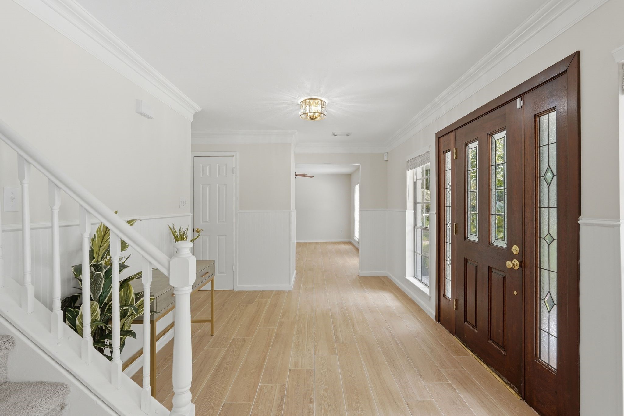 Notice the fresh paint and recently replaced wood look tile floors. Now we're going to go into the room straight in front of us, the room to the right of the front door.