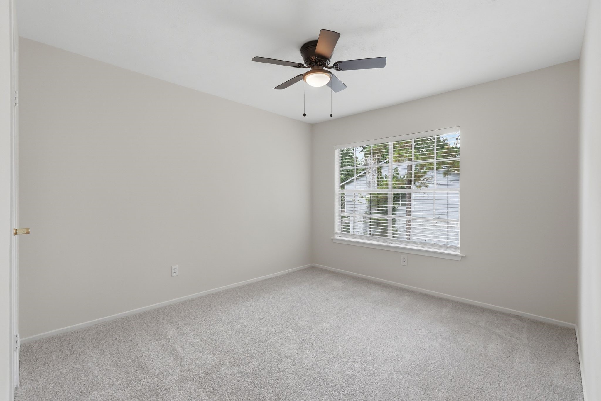 And last but not least, the third secondary bedroom upstairs again with a large window and walk in closet.