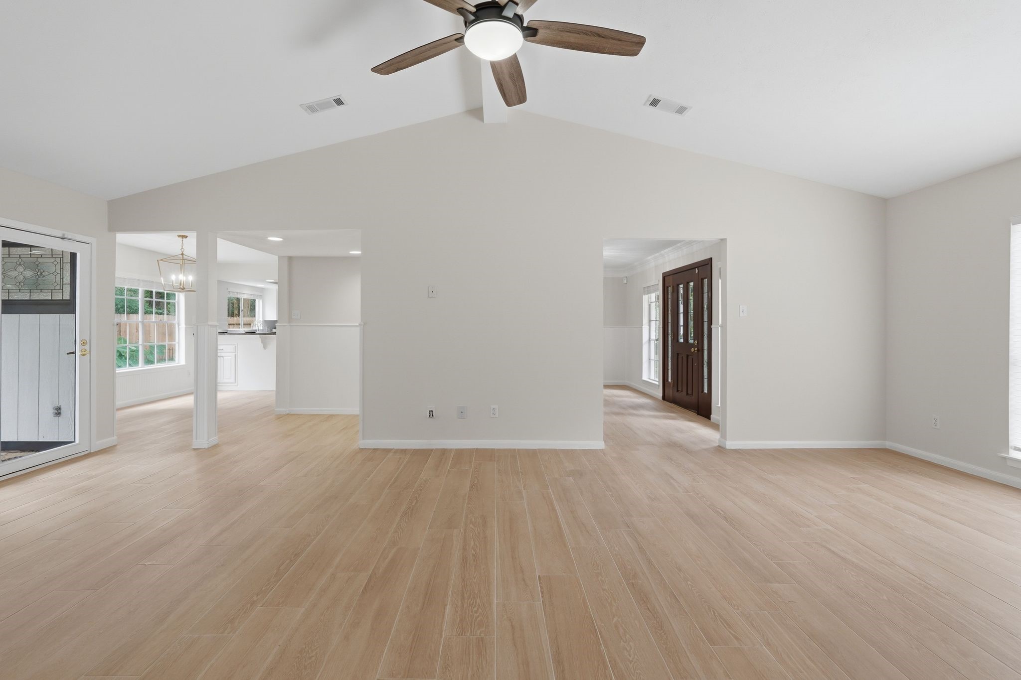 This shows just how big this space is. Notice your front door in the background to the right, your breakfast nook to the left and a door to your backyard in the far left. There is a cool little alcove between your living room and your breakfast nook. Make it a little office space, a dry bar, another seating area, or anything else you can dream up!