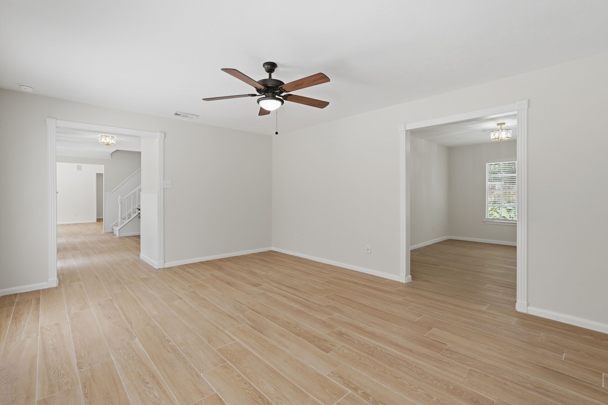 This room is a prime location close to the front door and through the door on the right, you'll find your formal dining room.