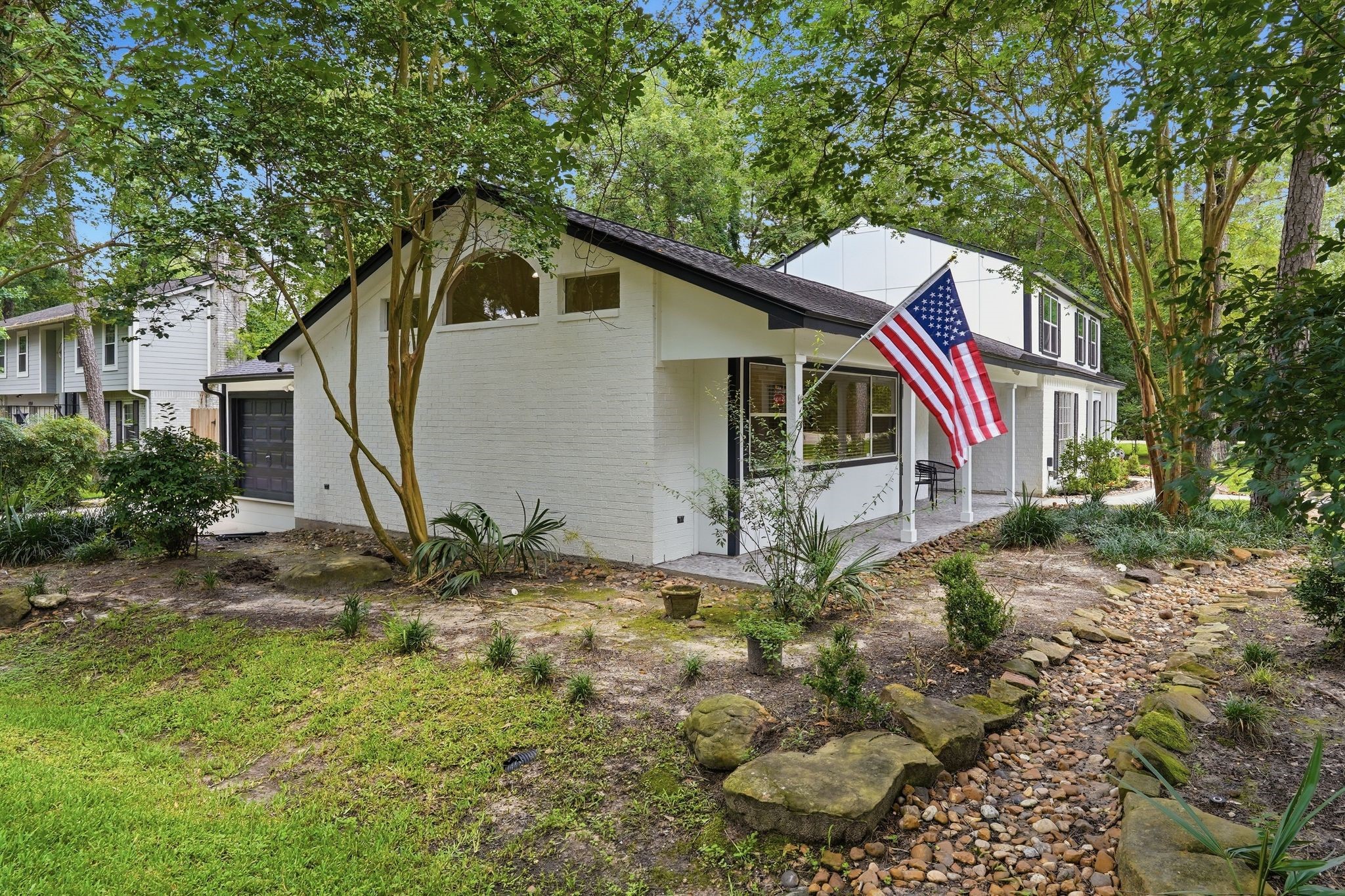 Tucked on the left side of your home is a large front porch and a peek at your garage with additional parking! Tucked on the left side of your home is a large front porch and a peek at your garage with additional parking!