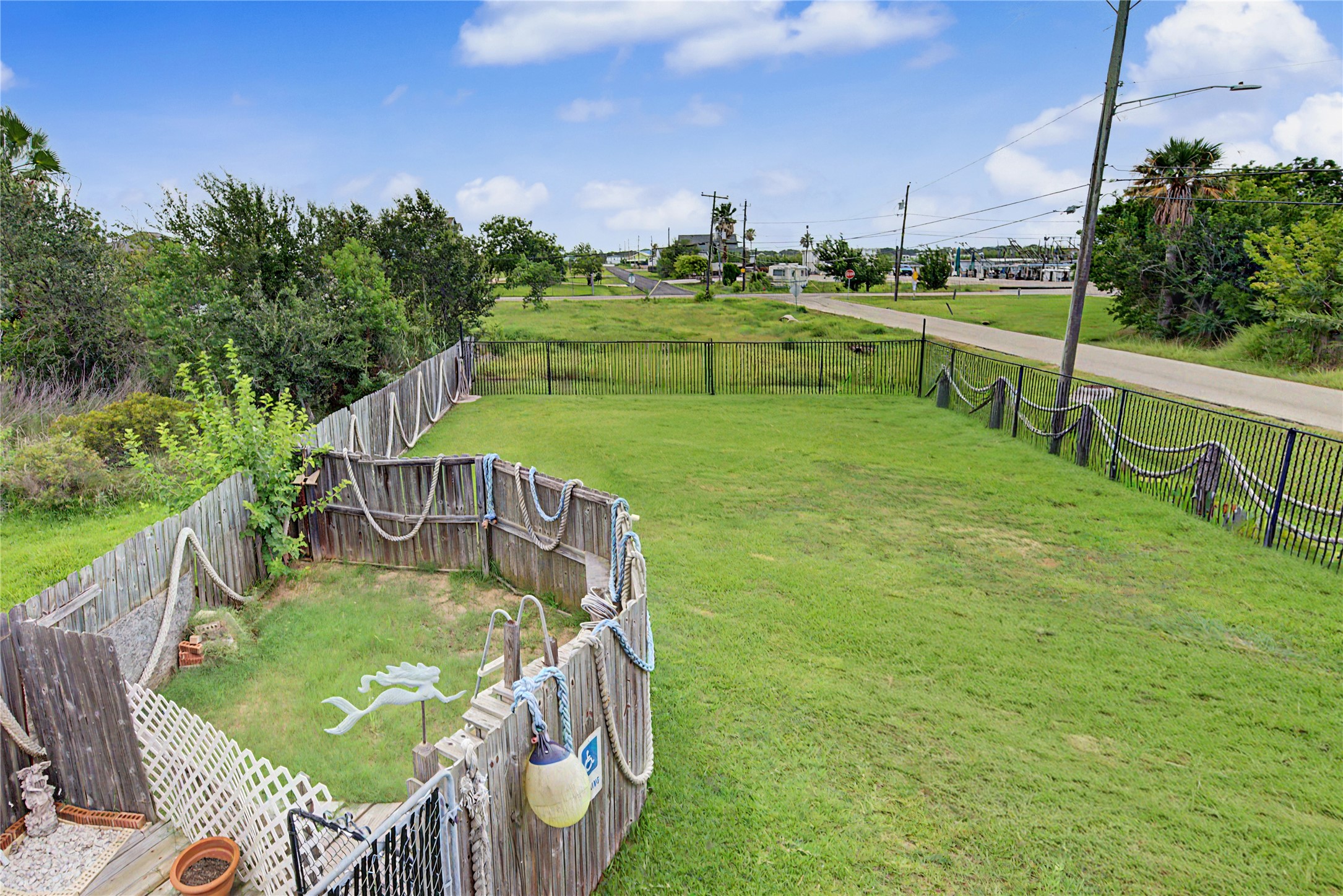 View of property from porch (the fenced area had a small above ground pool)