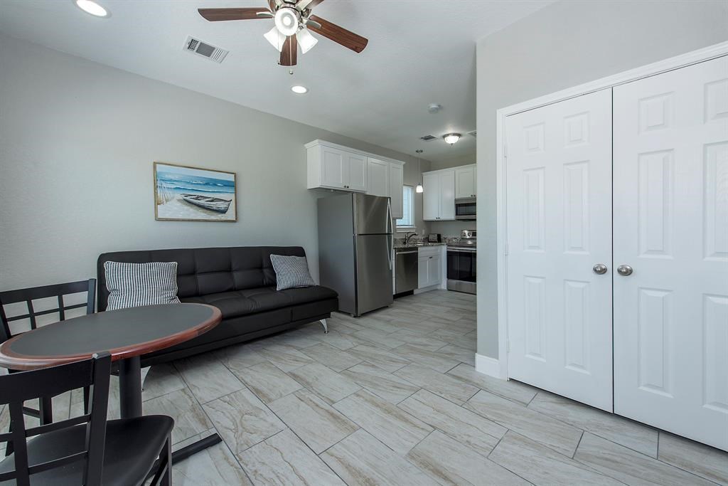 Tile flooring throughout in all units. Living area opens to kitchen.