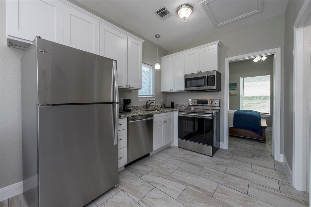 Granite Countertops, Stainless Steel Sink (and Appliances),
  Faucets & Pendant Lighting.