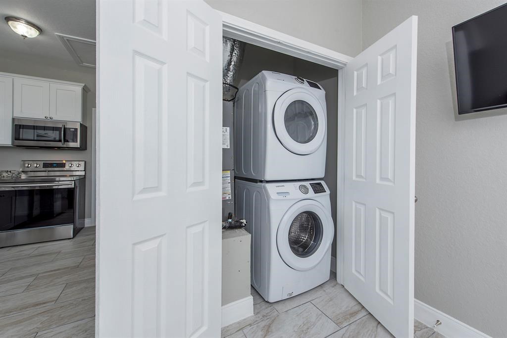 Concealable washer and dryer. Each Unit: Refrigerator / Washer / Dryer / Samsung 
  Range / Dishwasher / Microwave.