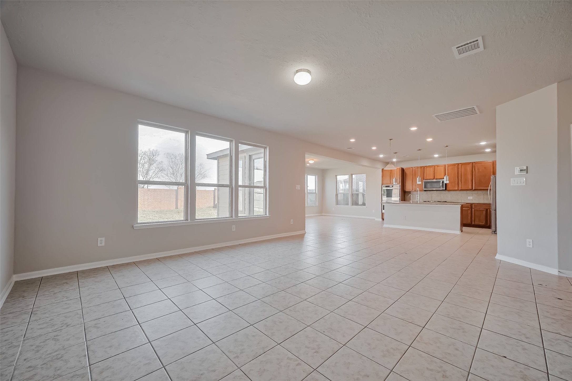 open concept living room with attached kitchen. open concept living room with attached kitchen.