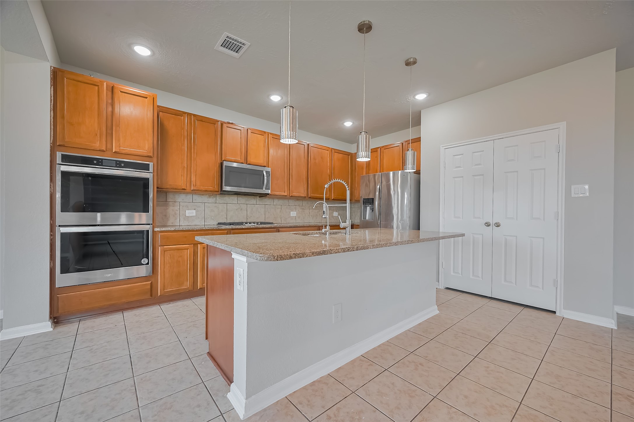 Stylish kitchen with granite countertops and premium stainless steel appliances.