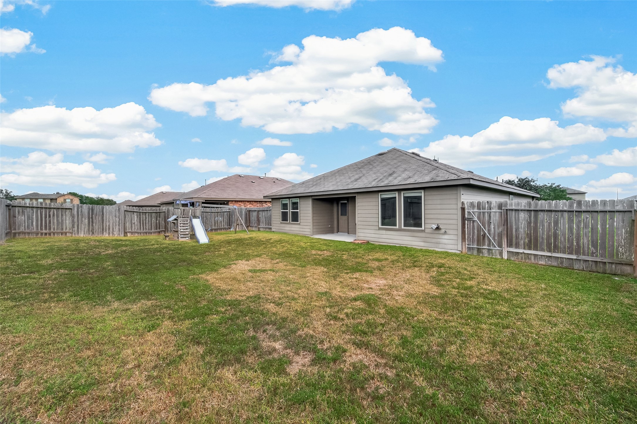 Back yard has ample place for your children and pets to run around.
