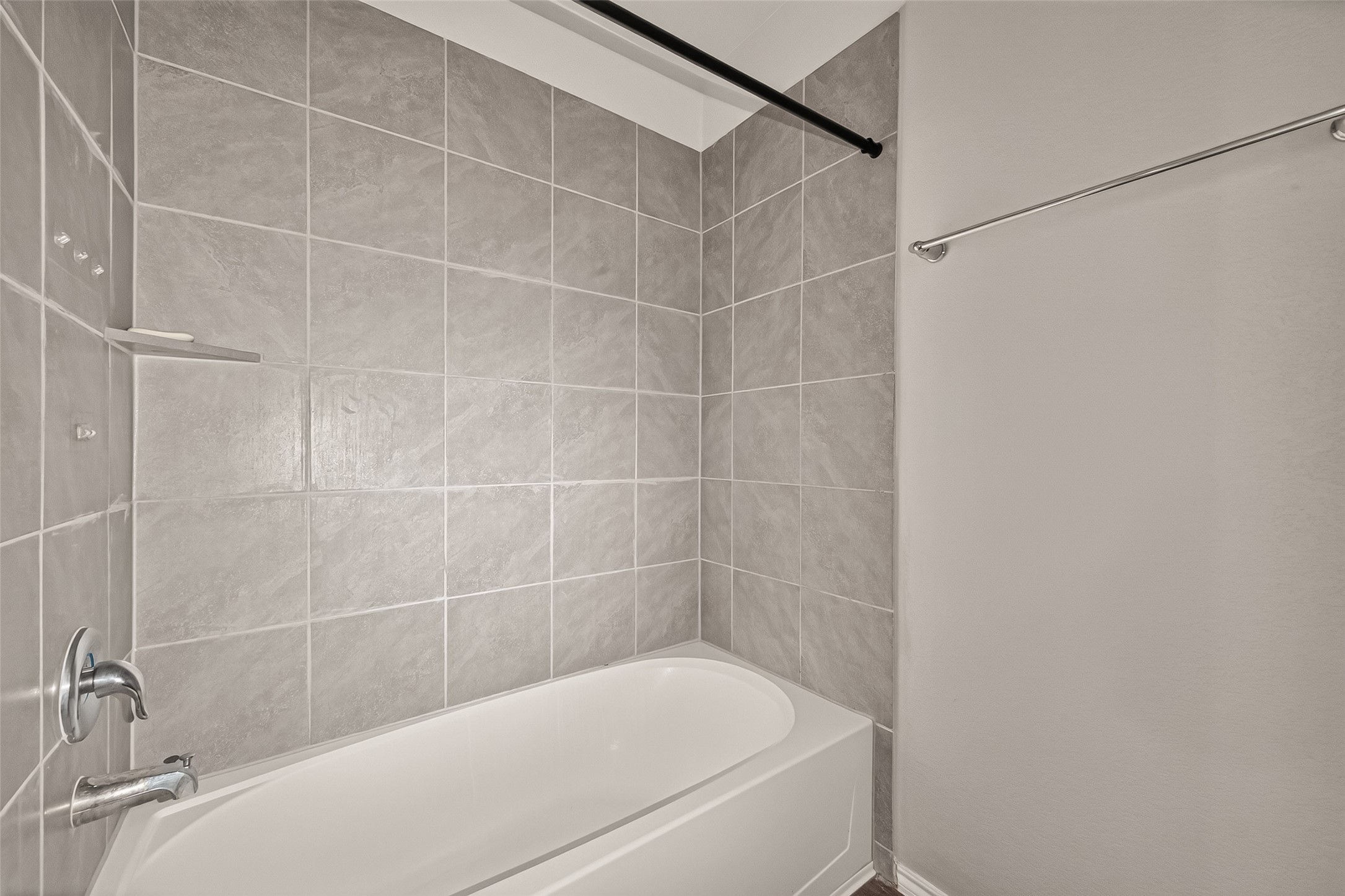 Tub shower combo in the secondary bathroom.