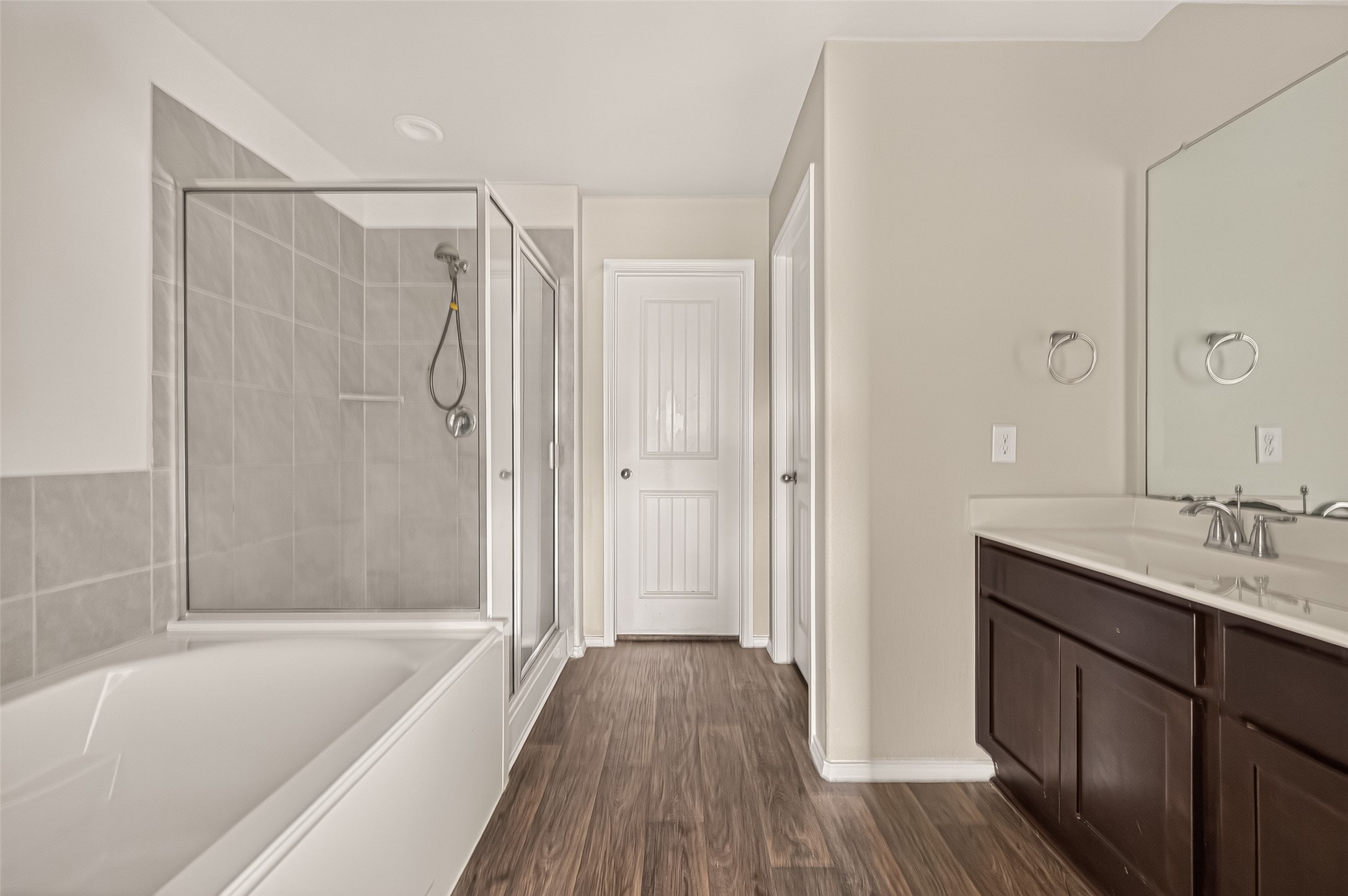 Separate shower and tub in the master bathroom.
