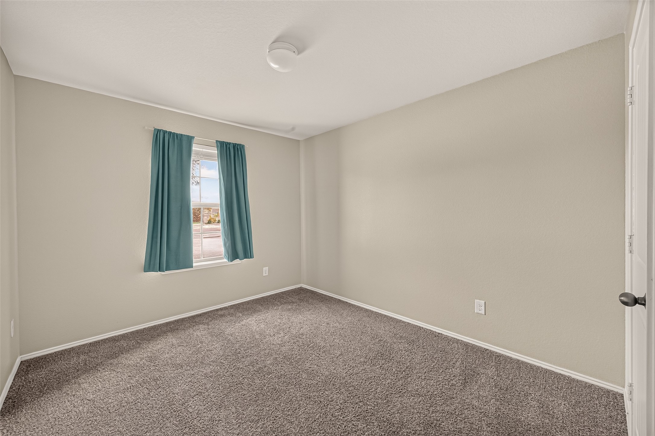 Secondary bedroom is big enough for a queen bed.