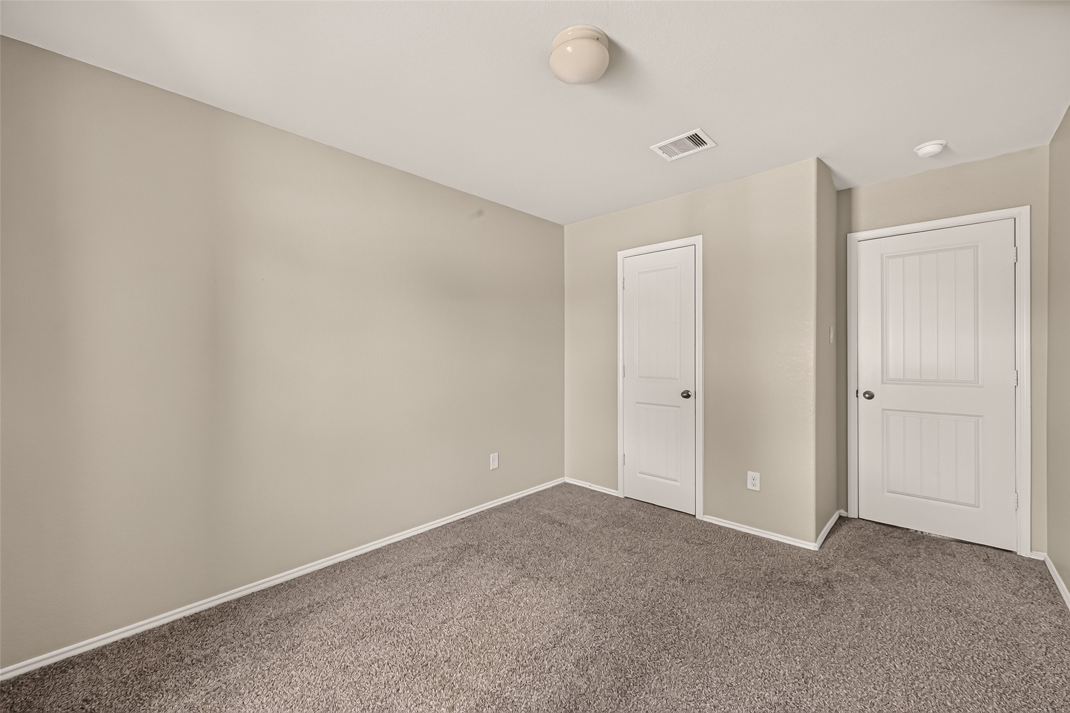 Big windows and carpet throughout the secondary bedrooms.